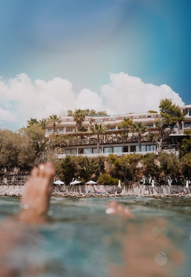 Gloria Maris Hotel Suites and Villa from the sea, boat tour floating swimming location