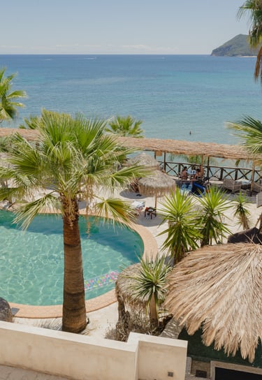 Gloria Maris Hotel Suites and Villa pool sun loungers breakfast