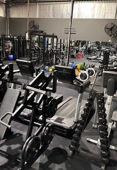 a gym with a lot of machines and a lot of machines