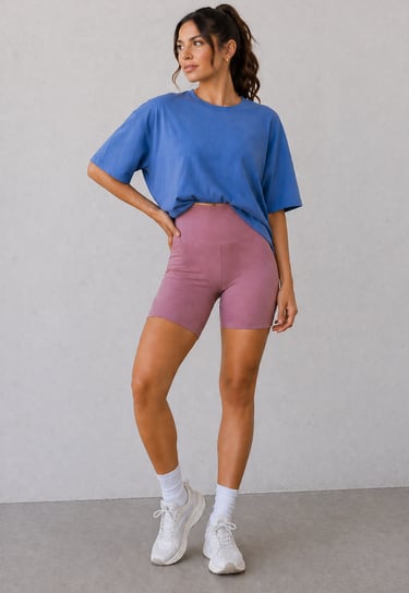 Biker shorts outfit idea for summer featuring oversized t-shirt styled for a casual athleisure look
