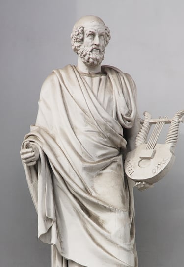 a statue of a man with a fan in his hand