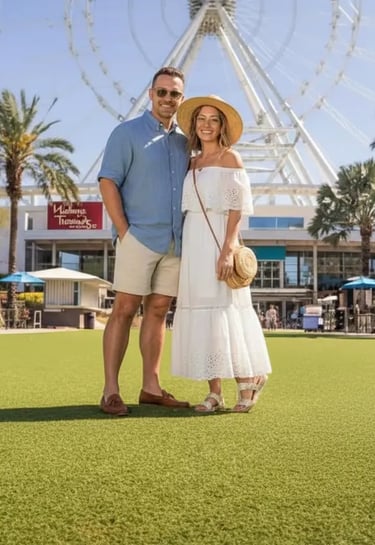 Happy couple posing in front of The Wheel at ICON Park in Orlando, Florida. A perfect romantic dayti