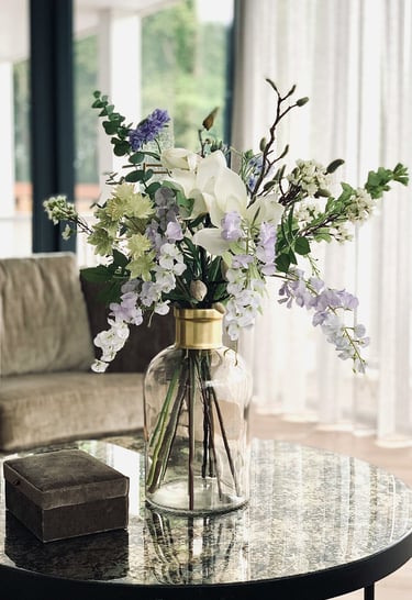 a vase with flowers on a table