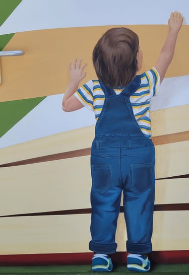 Détail d'une fresque murale: un garçon debout de dos se hisse sur la pointe de pieds. Viry, Jura.