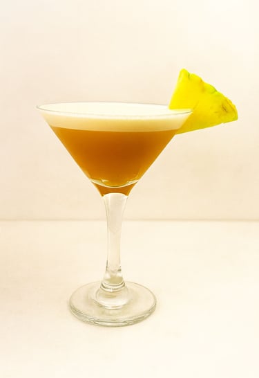 Caribbean Pearl cocktail with pineapple spiced rum and angostura bitters served at event bar