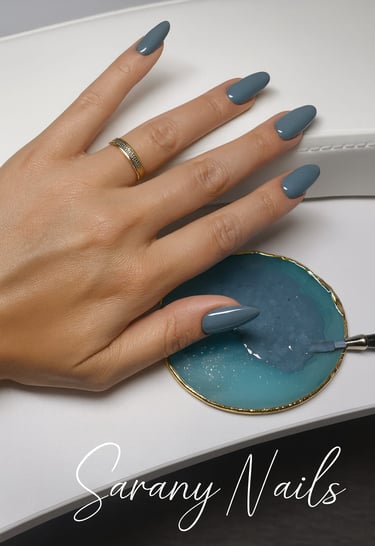 a woman's hand with a manicured manicured nail polish