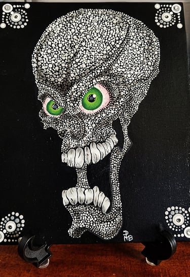 A screaming skull, green eyes, black background.