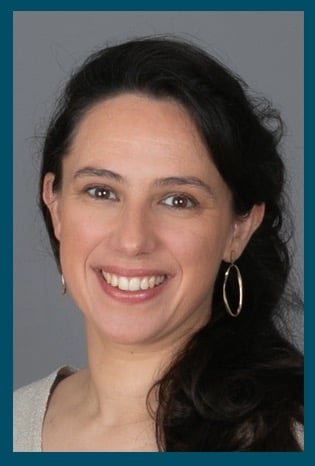 a woman with a large smile on her face