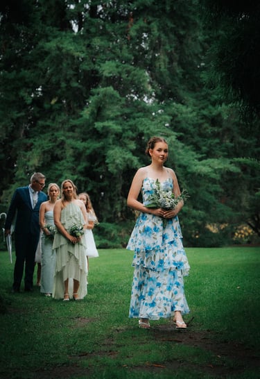 Bride walking down the aisle at Araucaria Avenue in Adelaide Botanic Garden