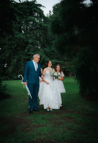 Bride walking with family before the outdoor wedding ceremony in Adelaide