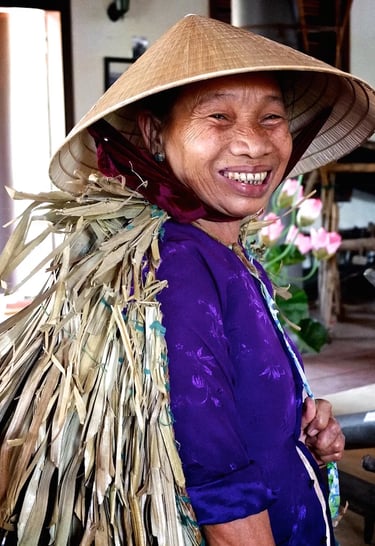 a woman in a hat with a straw hat