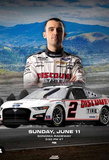 Austin Cindric, Discount Tire Nascar driver, posing in a photoshoot with his racecar