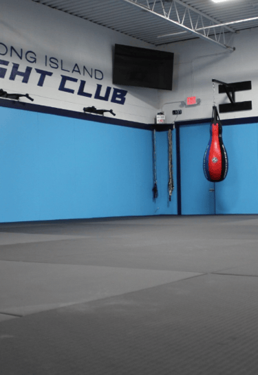 Long Island Fight Club gym interior with punching bags 