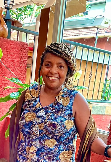 Chinwe O., founder of Bonya Books and retired reading specialist, smiling warmly