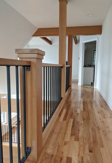 Fir wrapped posts, open iron railing