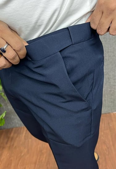 a man in a white shirt and a ring on his finger