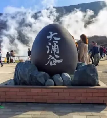 Giant black egg monument at Owakudani volcanic valley in Hakone, famous for its sulfur springs and t