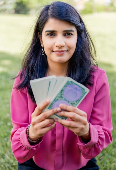 Dr. Rio Kashyap holding a stack of Tarot cards in her hands