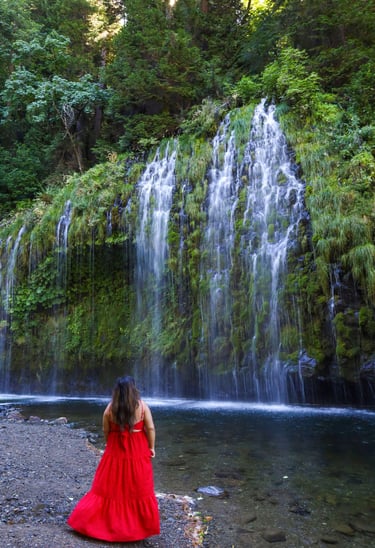 california, waterfalls, mossbrae falls, a woman in a red dress standing in front of a waterfall
