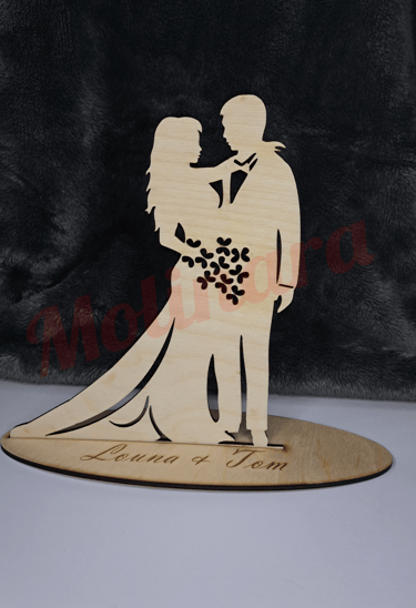 a wooden cutout of a wedding couple