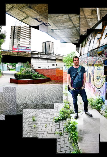 A Joiner photo of Nick standing next to an urban wall