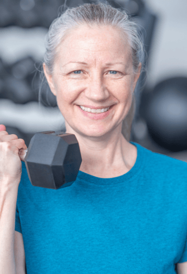 a woman doing strength training with a dumbbell in her hand