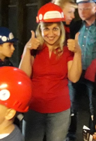 a woman in a red shirt and a boy in a red hat