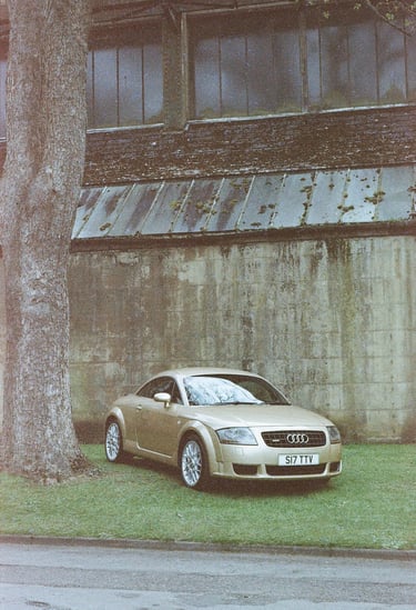 an Audi TT parked on grass 
