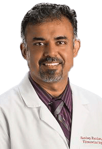 man wearing a white lab coat with a shirt and tie on
