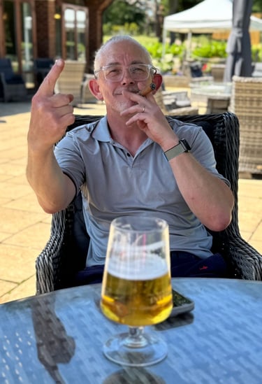 Sat on the patio at the golf club with beer and cigar