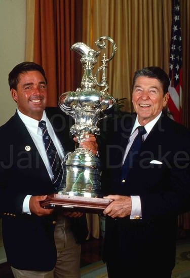 Ronald Reagan and Dennis Conner with the America's Cup at the While House in 1987 by James Drake