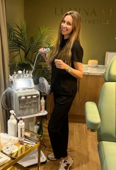 a woman in a black dress standing in a salon