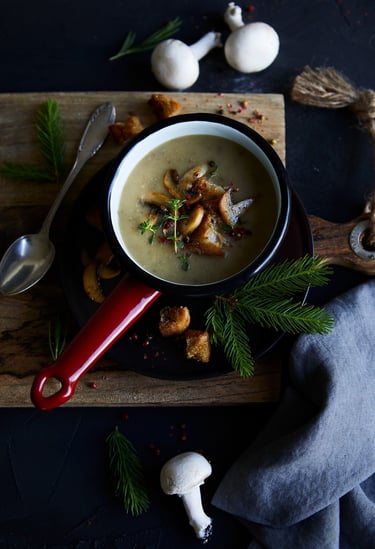 a bowl of soup with mushrooms and mushrooms
