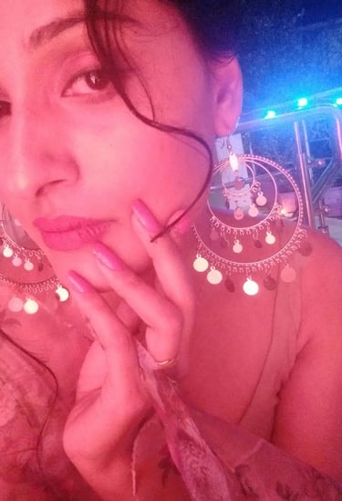 a woman with a large earring and a large earring