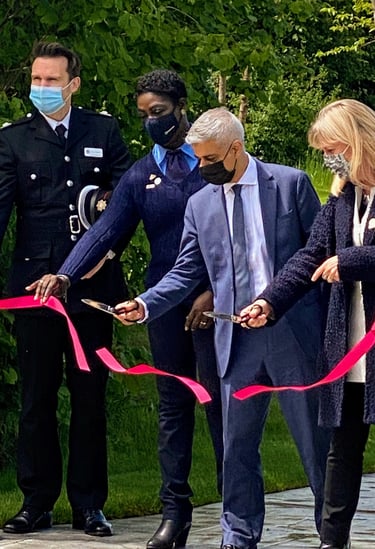 The mayor of London cutting ribbon at the opening of Blossom Garden at Queen Elizabeth Olympic Park