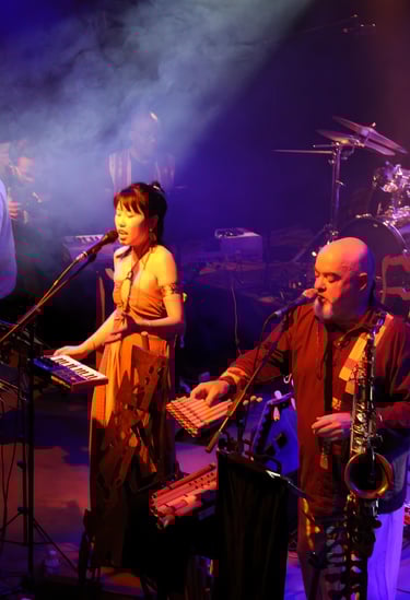 a band of musicians performing on stage