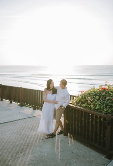 Couple walking by the ocean during a proposal photography session at Anantara Uluwatu Bali Resort.