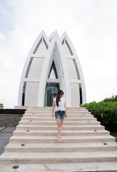 Family photography moment near the iconic chapel architecture at The Ritz-Carlton Bali in Nusa Dua
