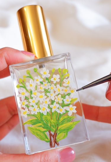 Perfume bottle personalized with floral painting by NYC live event artist Handwritten by Belle.