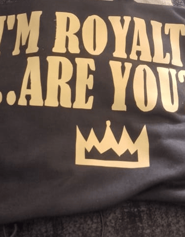 "I'm Royalty are you?" text. Gold on black
