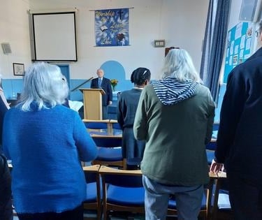 Picture of people at a worship service