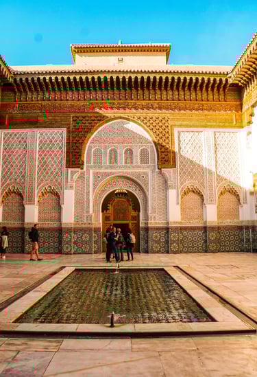 Traditional Moroccan riad courtyard with mosaic tiles and Islamic architecture