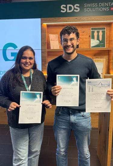 a man and woman holding up their certificates