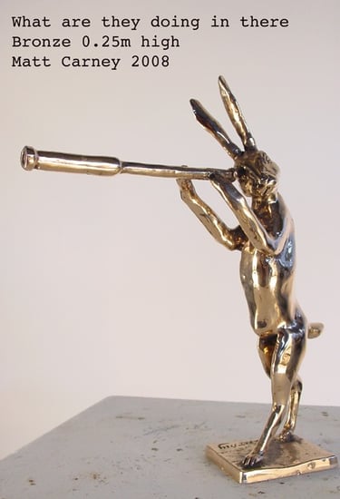 a sculpture of a rabbit looking through a telescope