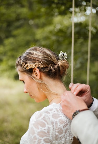 a man and woman standing in front of a swing