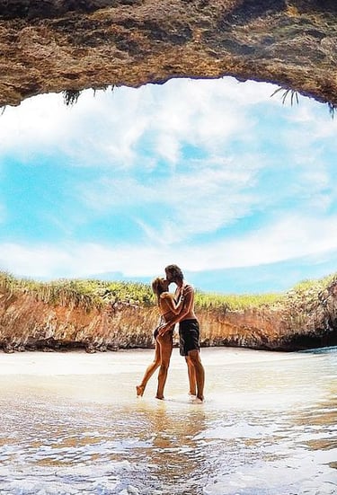 a couple kissing in a cave Marietas