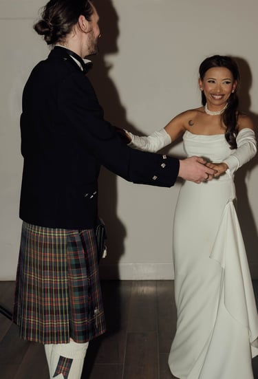 a man in a kiltrum kilt and a woman in a kilt