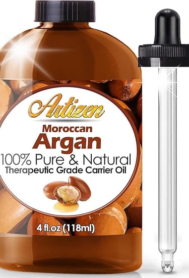 a bottle of argan oil with a glass bottle of argan oil