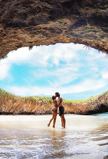 a couple kissing in a cave Marietas