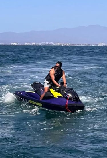 a man riding a jet ski in the ocean